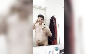 21yo boy peeing in a transparent cup, and drinks his own pee (in front of the mirror) - 12 image
