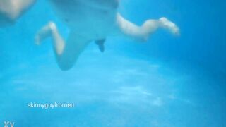 skinny boy swimming naked in outdoor pool - 2 image