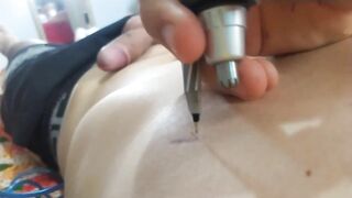 Tattooing his own cock with a needle and homemade machine. - 13 image