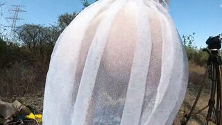 Sunbathing, squatting and masturbating in a public place wearing a sheer robe - 4 image