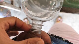 Malleable stick in the disinfectant bottle of the young straight slave.