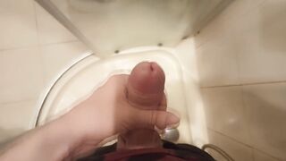The guy masturbates his dick standing in the shower and cums - 12 image