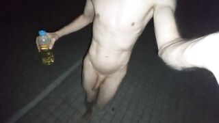 Nude in public playing with piss