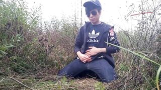 Cute gay Asian twink Jon Arteen speaks French, masturbates his smooth penis in the rain, lubricated with his saliva, moans, ejaculates sticky cum on his fingers - 2 image