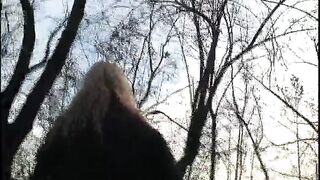 A blonde milf with amazing boobs flashing pussy and tits in a park