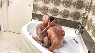 Muscular stud passionately pounds a kinky lesbian in a steamy jacuzzi - 1 image
