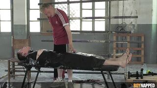 Watch young man dominated & boynapped by a kinky femdom in Part 2 of Twink's barefoot foot fetish adventure - 12 image