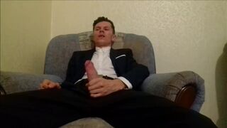 After working in the office, the guy jerks off his cock and ends up in an office suit - 1 image