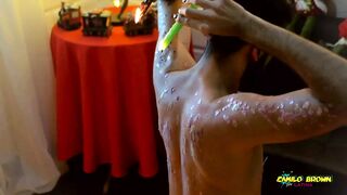 Young Uncut Latino In Colorful Christmas Wax Play With Carols In The Back - 1 image