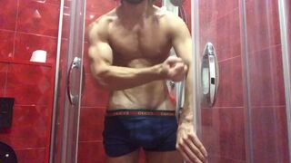 Handsome muscular guy takes a shower and masturbates - 1 image